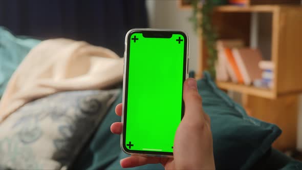 Closeup of Smartphone with Green Screen Young Man Hands Holding Mobile Phone Isolate Display Touch