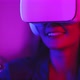 Young asian woman is using virtual reality headset. Neon light studio portrai - VideoHive Item for Sale