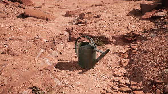 Beverage Can in Sand and Rocks Desert