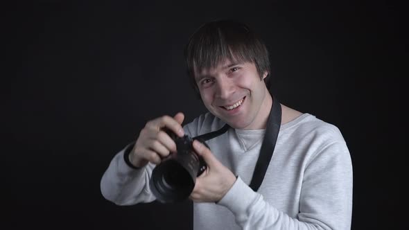 Photographer Taking Pictures On Dark Background