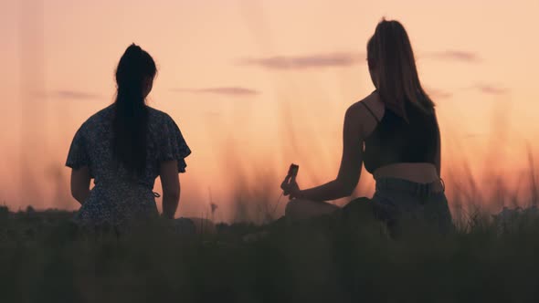 Women Relaxing Outdoor Summer Evening Picnic