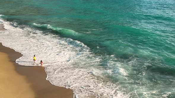 Happy children play on the sea waves Turkey Alanya