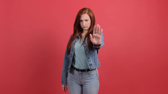 Young Woman Making Stop Gesture with Her Hand