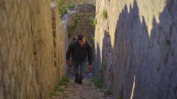 A Man Tourist Visits the Old Town of Kotor in Montenegro