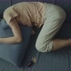 A Young Woman Lies on the Bed with Her Head Under the Pillow - VideoHive Item for Sale