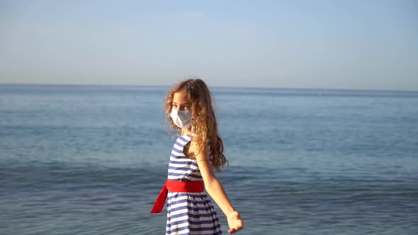 Happy child with medical mask outdoor against blue sky background