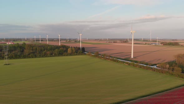 Panoramic View Of Wind Turbines And Farm Landscape In Flevoland, Netherlands. aerial drone