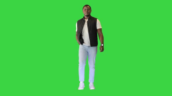 Casual African American Man Walking on a Green Screen Chroma Key