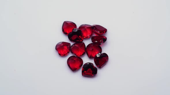 Natural Red Garnet Gemstone on the White Background on the Turning Table