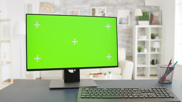 Display with Green Screen in Cozy and Well Lit Living Room