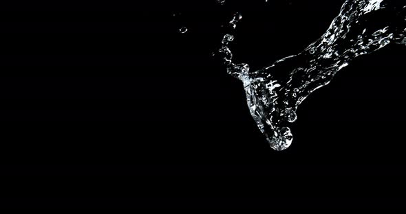 Water Exploding and Splashing against Black Background, Slow motion 4K