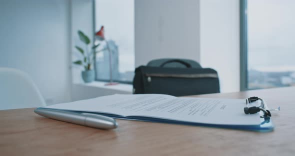 Pen lying on a desk with contract or application form