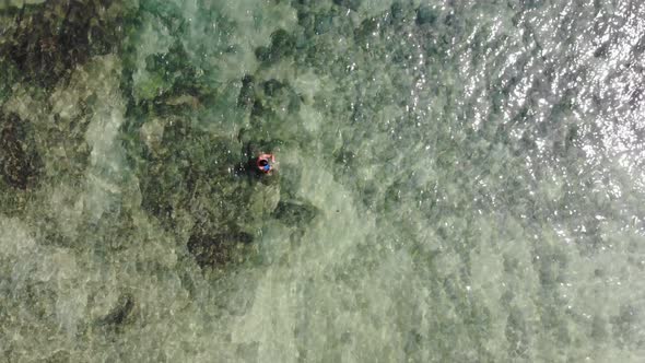 Panama in February drone shoots Contadora Island swimming in between fishes capture with a drone.th