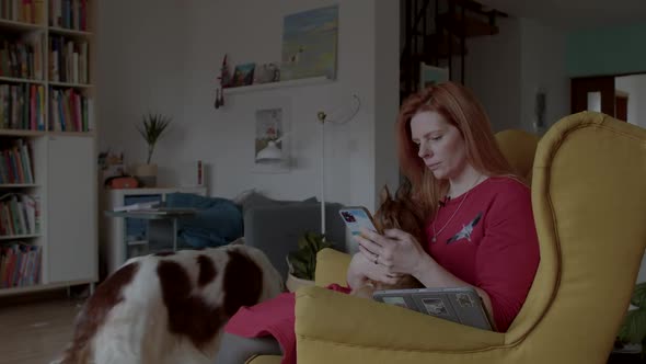 Woman with Dogs Contacts a Patient By Phone Before an Animal Therapy Session