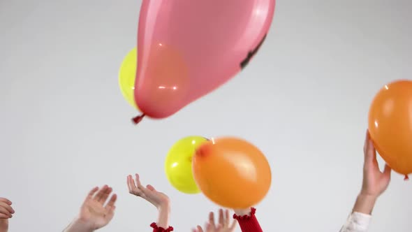 Humand Hands and Flying Balloons Wirh Cryptocurrency