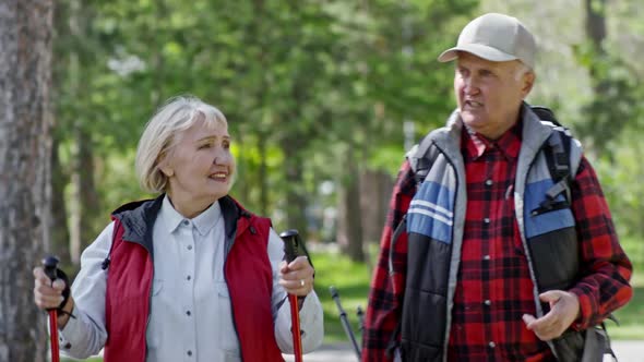 Elderly Woman and Senior Man Trekking in Park