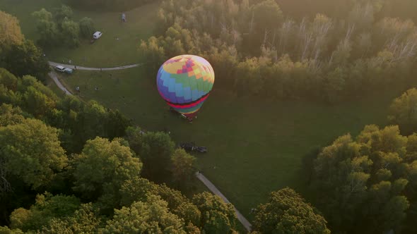 Aerial View of Colorful Hot Air Balloon Prepare for an Summer Early Morning Flying in Park in Small