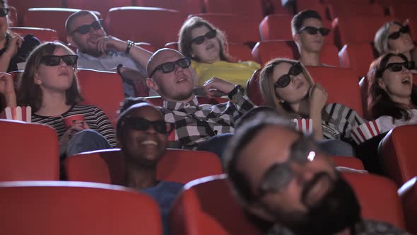 Happy Viewers Imitating Moving While Watching Film