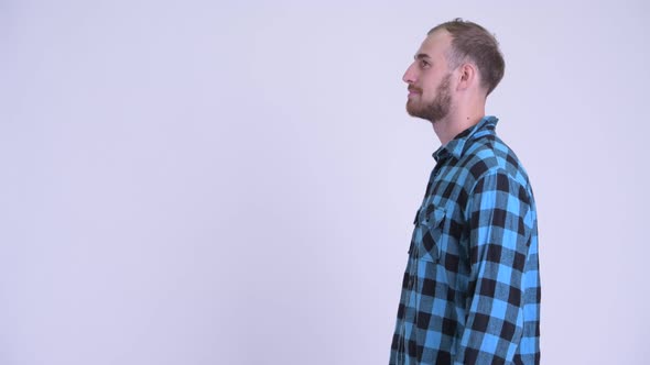 Profile View of Happy Bearded Hipster Man Smiling