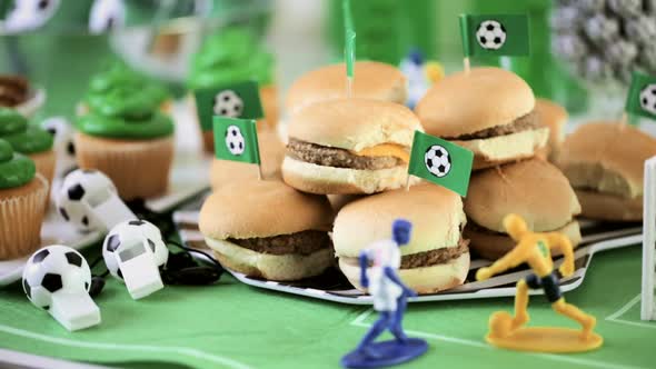 Kids football party set with snacks and drinks.