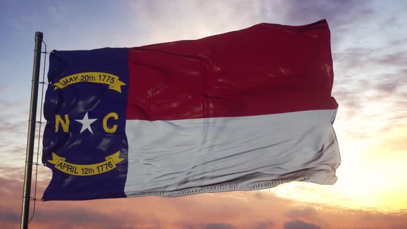 Flag of North Carolina Waving in the Wind Against Deep Beautiful Sky at Sunset