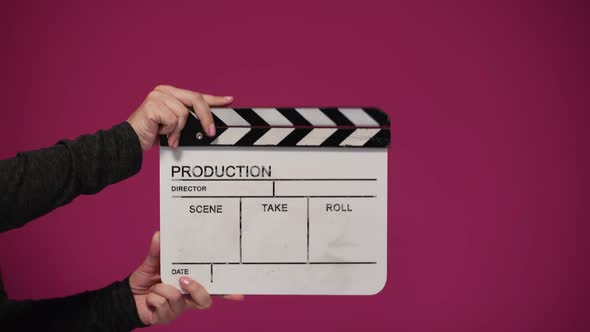 Human Hands Hold and Clap with Clapperboard