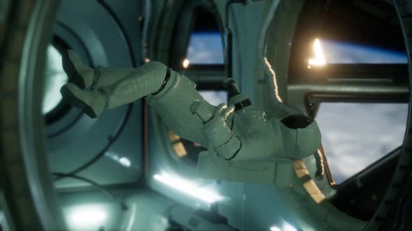 Astronaut Inside the Orbital Space Station alt