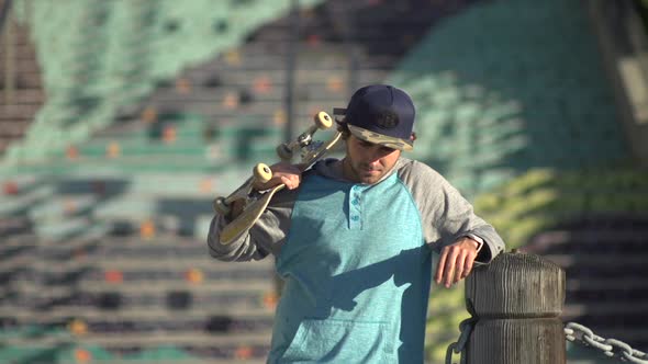 Portrait of a young man skateboarding