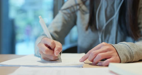 Woman write on the paper note