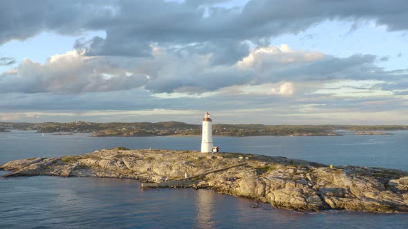 Lille Torungen Lighthouse Against Stormy Sky In Arendal, Norway - aerial drone shot