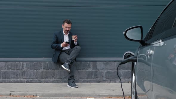 Man Uses Phone Waiting