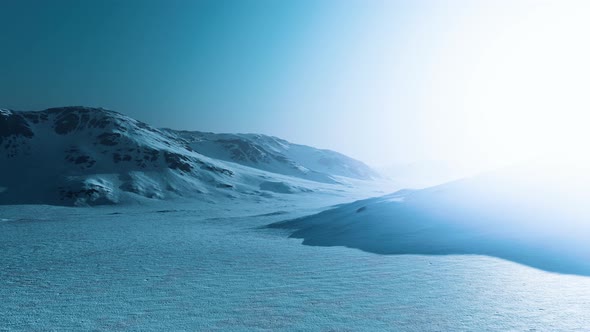 Snowed Mountains in Alaska with Fog