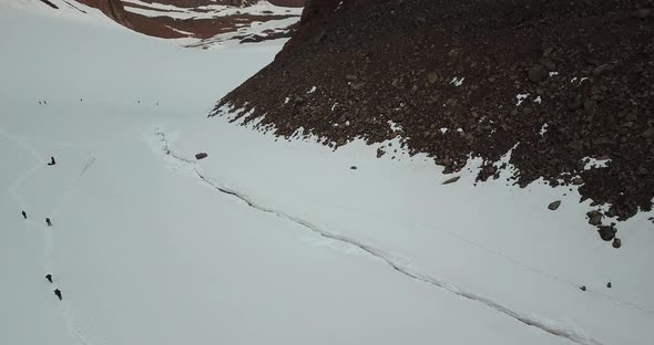 A Large Group of Climbers Climb To the Top