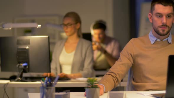 Male Office Worker with Laptop Working at Night 35