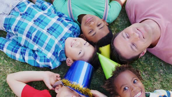 Man with kids lying on field 4k