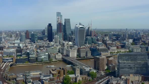 Drone shot of City of London Business district skyscrapers from south of the river thames