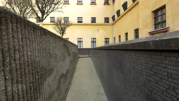 Names of dead prisoners on a wall 