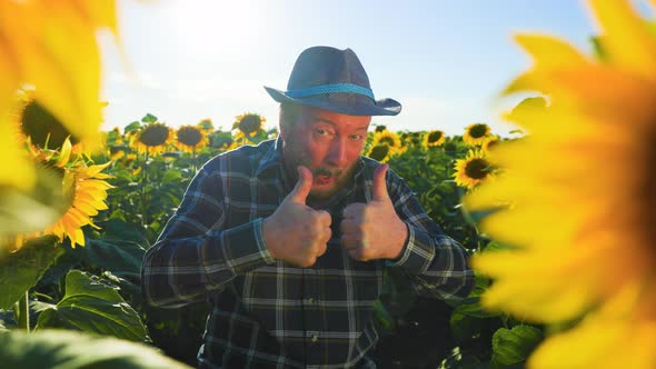 Emotive Surprised Shocked Bearded Young Farmer Male Show Thumbs Up Opens Mouth Widely