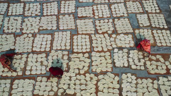 Aerial view of Women at work on the preparation of natural fabric, Rajshahi.