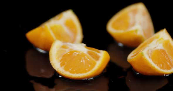 Sliced Mandarin Falls on the Table. 