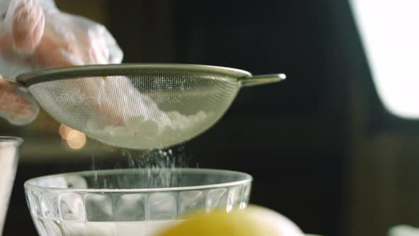 I Give Powdered Sugar Through a Stainless Steel Sieve