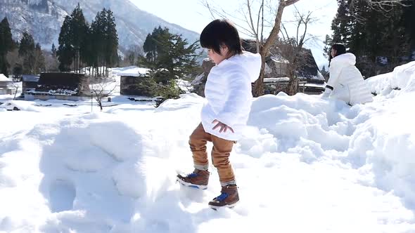 Cute Asian Child Playing Snow Outdoors Slow Motion
