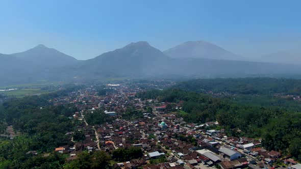 Scenic aerial panorama of Grabag village and three volcanoes, Java, Indonesia