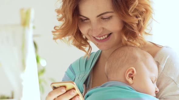 Close Up Footage in Slowmotion of Caucasian Middleaged Happy Female Looking at Mobile Phone While