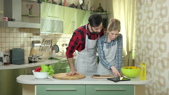 People with Tablet in Kitchen