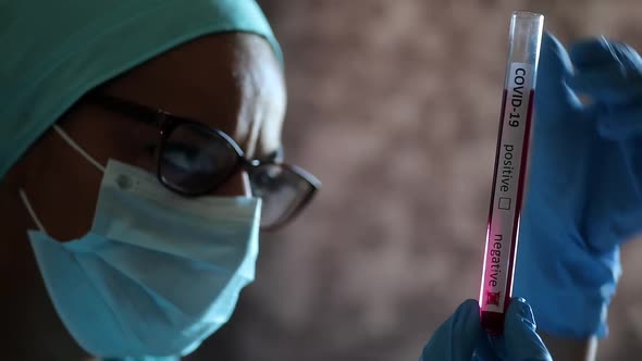 Doctor hands holding a coronavirus COVID-19 negative test tube