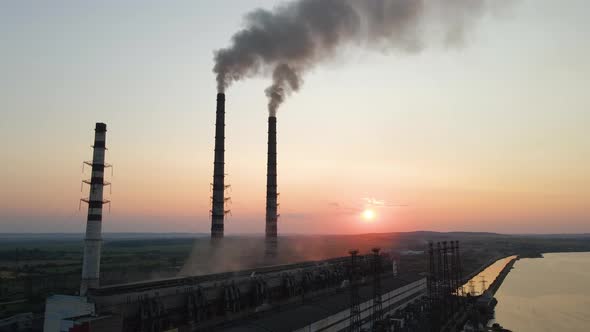 Aerial View of Coal Power Plant High Pipes with Black Smoke Moving Upwards Polluting Atmosphere at