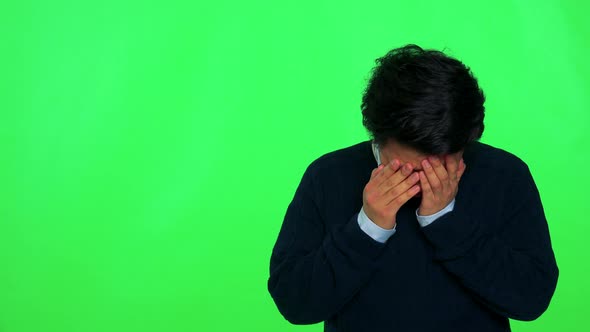 A Young Asian Man Crying - Green Screen Studio