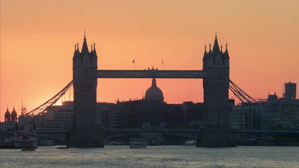 Time-lapse of Tower Bridge at sunset, London, UK. In the background between the towers of Tower Brid