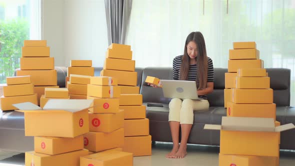 Woman with packing box ready for shipping